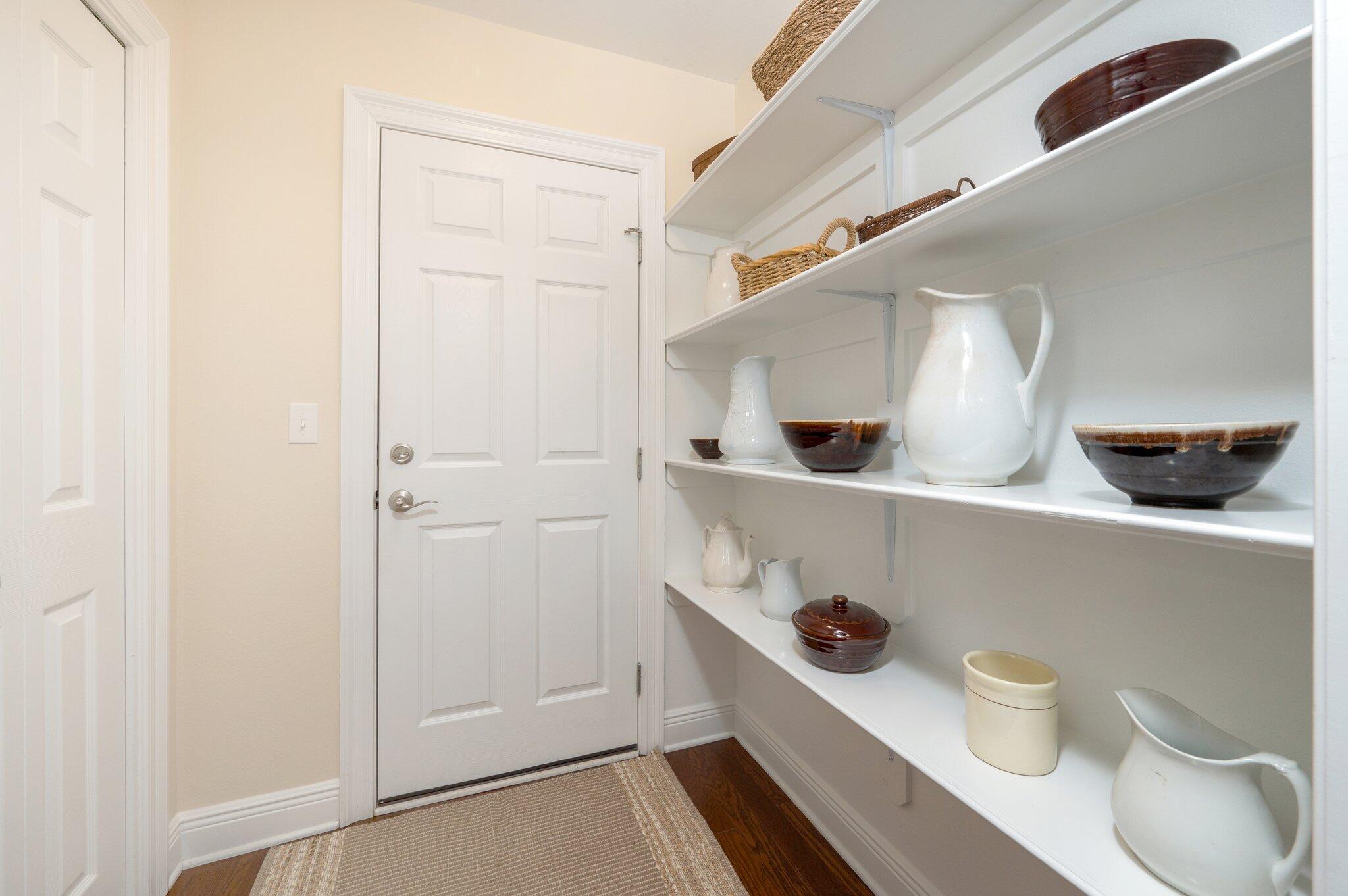 5777 Buckward Road Baker, FL 32531 - Photo 24 of 60 a bathroom with a toilet a sink and wooden floor