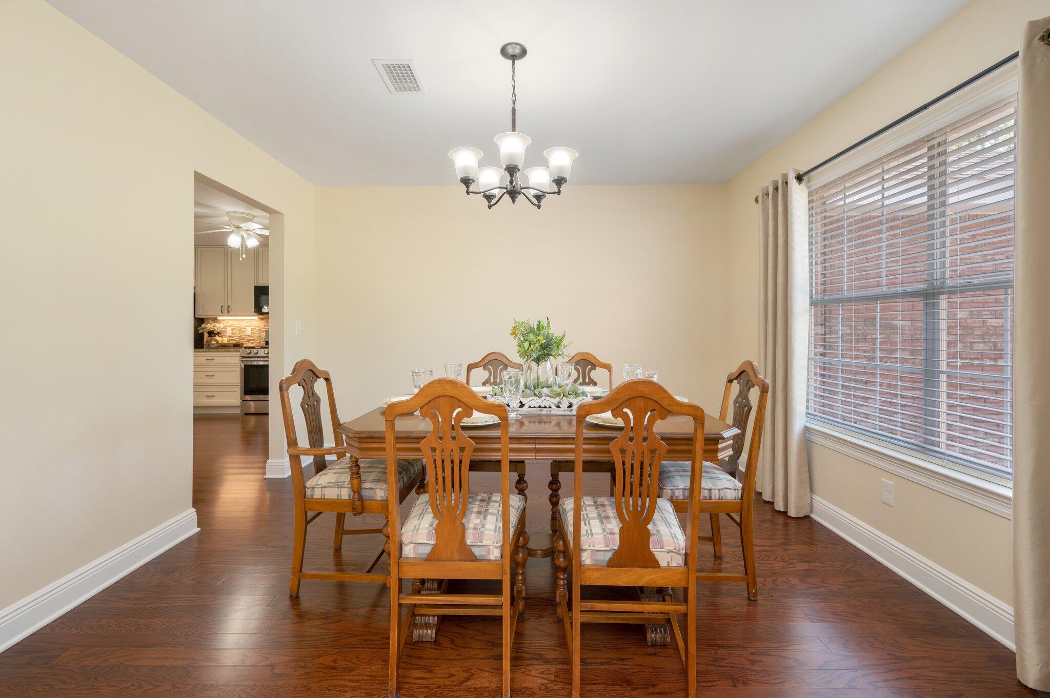 5777 Buckward Road Baker, FL 32531 - Photo 25 of 60 a view of a dining room with furniture window and wooden floor