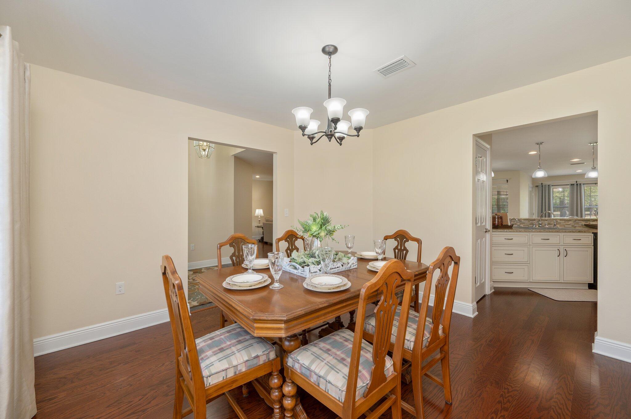 5777 Buckward Road Baker, FL 32531 - Photo 26 of 60 a view of a dining room with furniture and wooden floor