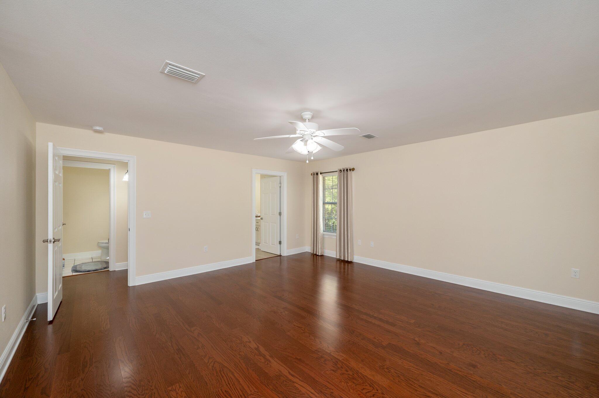 5777 Buckward Road Baker, FL 32531 - Photo 31 of 60 a view of an empty room with wooden floor