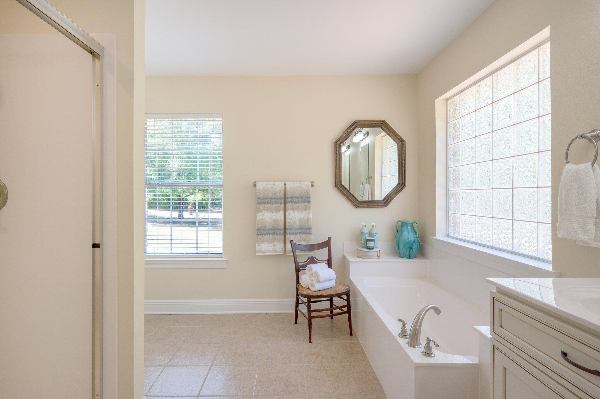 5777 Buckward Road Baker, FL 32531 - Photo 33 of 60 a bathroom with a sink a bathtub and a window