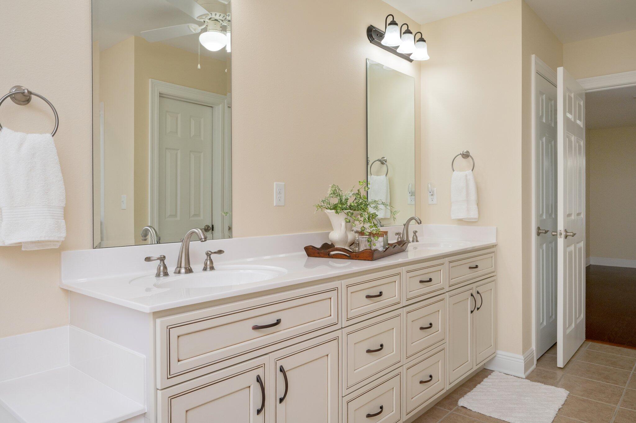 5777 Buckward Road Baker, FL 32531 - Photo 36 of 60 a bathroom with a sink double vanity and a mirror