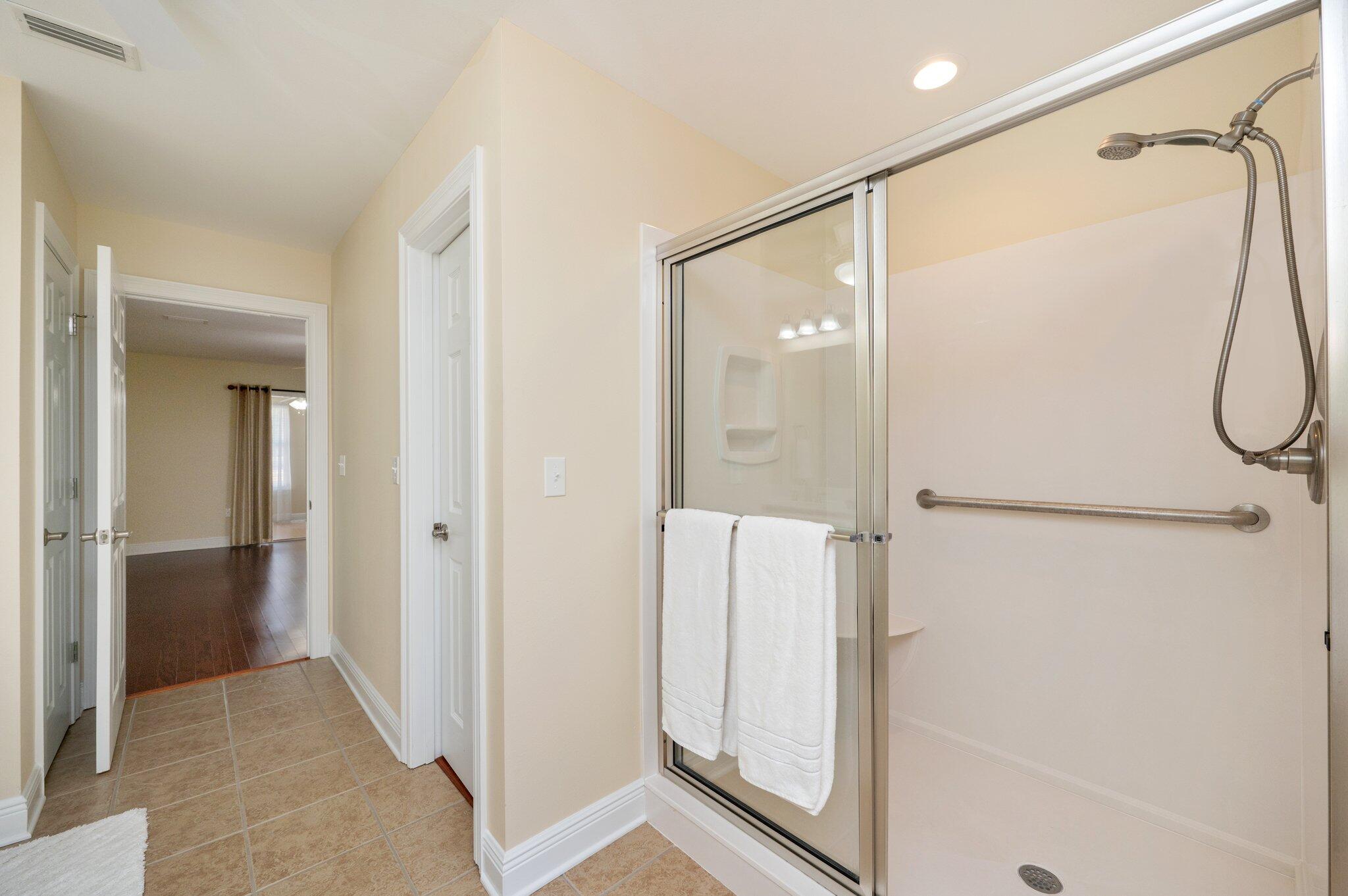 5777 Buckward Road Baker, FL 32531 - Photo 37 of 60 a bathroom with a shower and a glass door