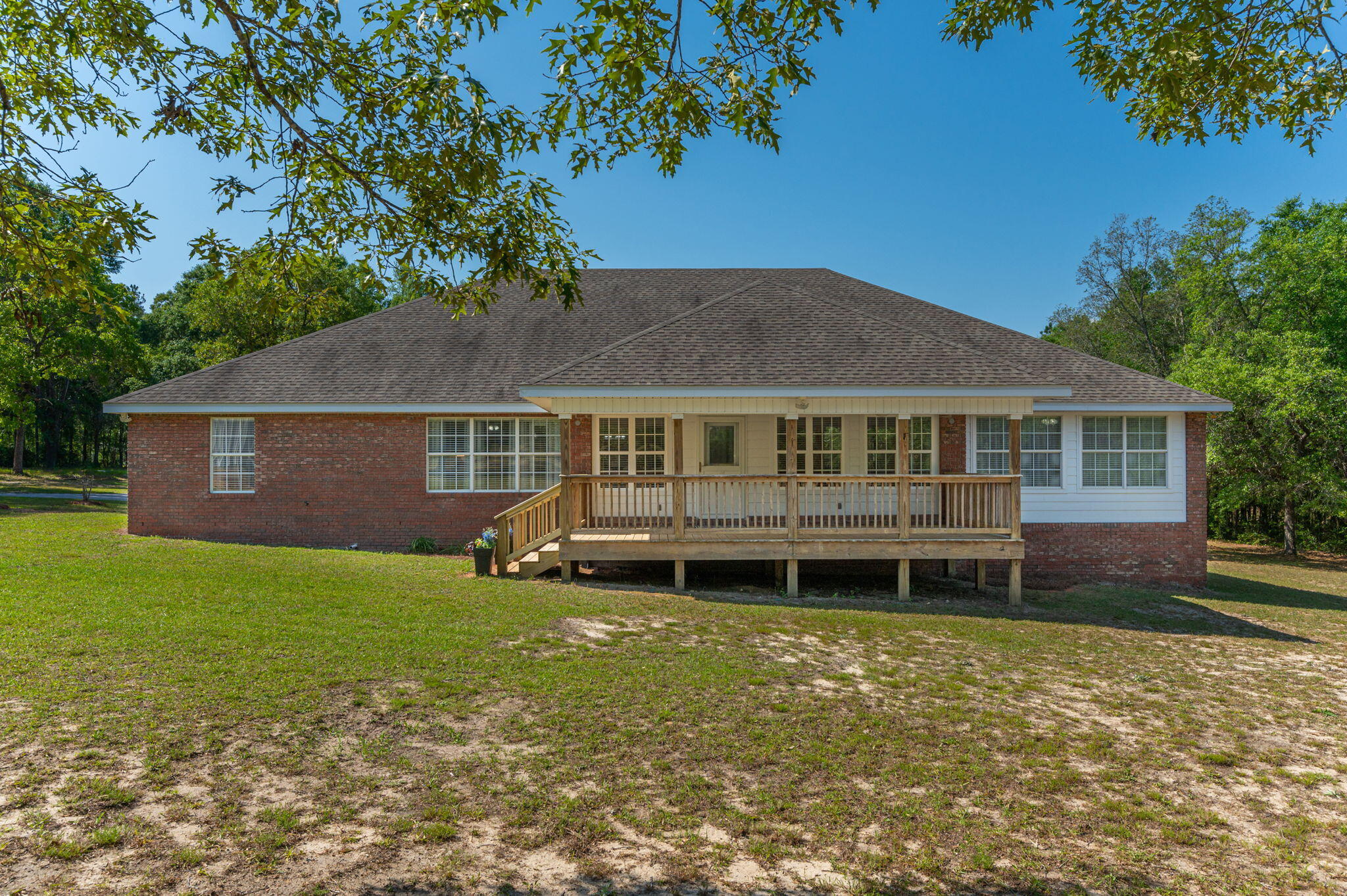 5777 Buckward Road Baker, FL 32531 - Photo 47 of 60 a front view of a house with a garden