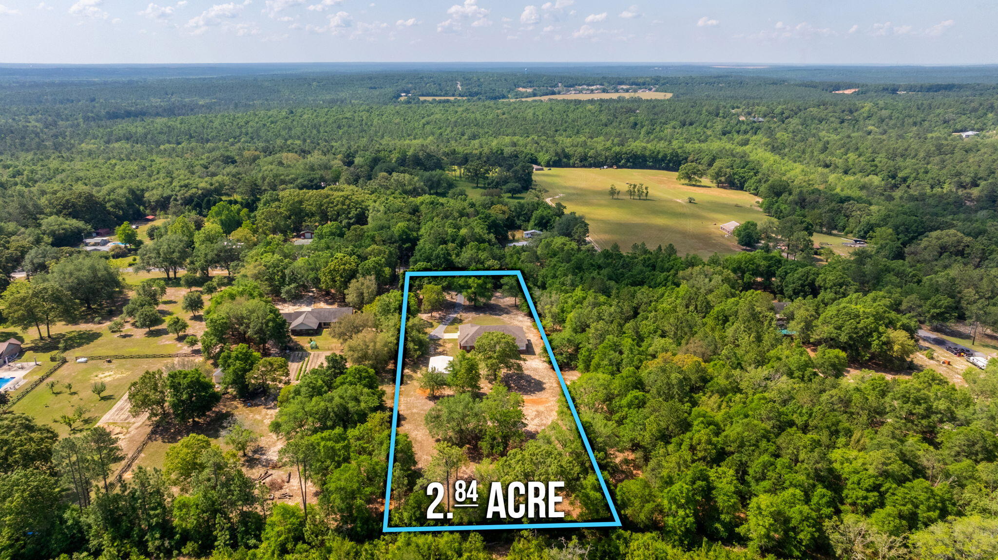 5777 Buckward Road Baker, FL 32531 - Photo 57 of 60 an aerial view of a residential houses with outdoor space and trees