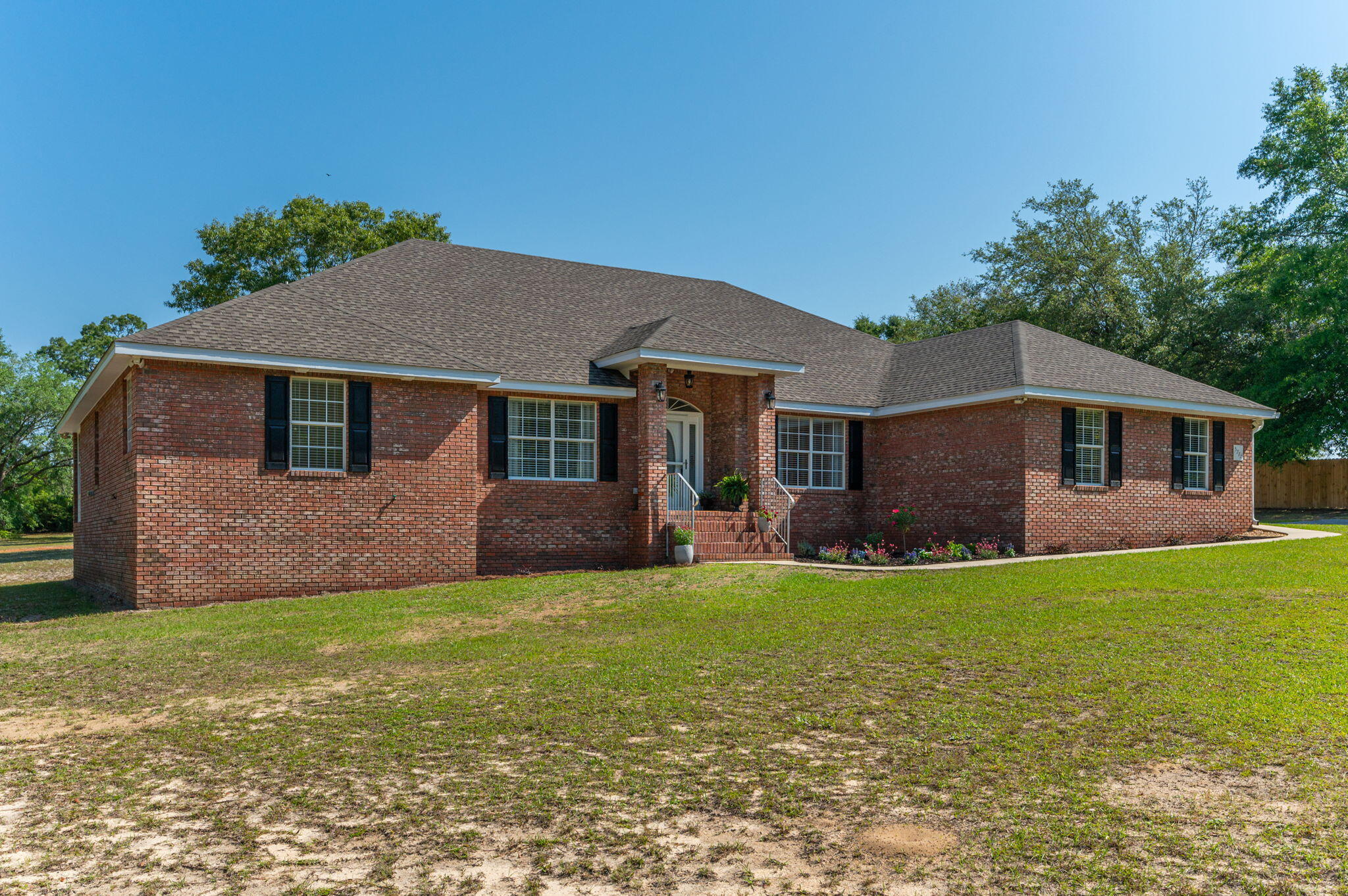 5777 Buckward Road Baker, FL 32531 - Photo 7 of 60 a front view of a house with a yard