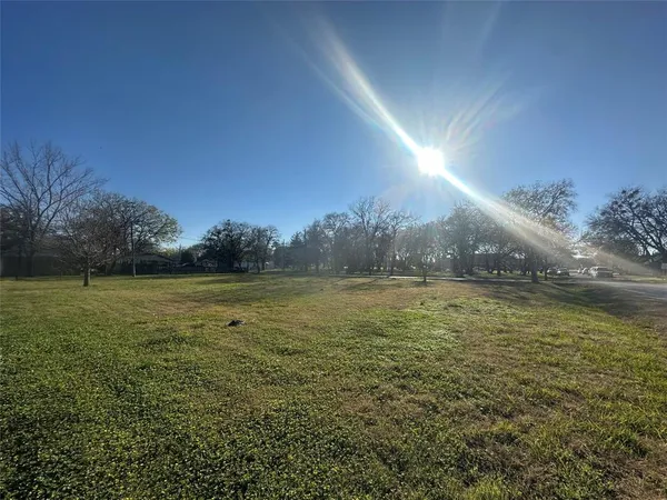a view of an ocean and a yard