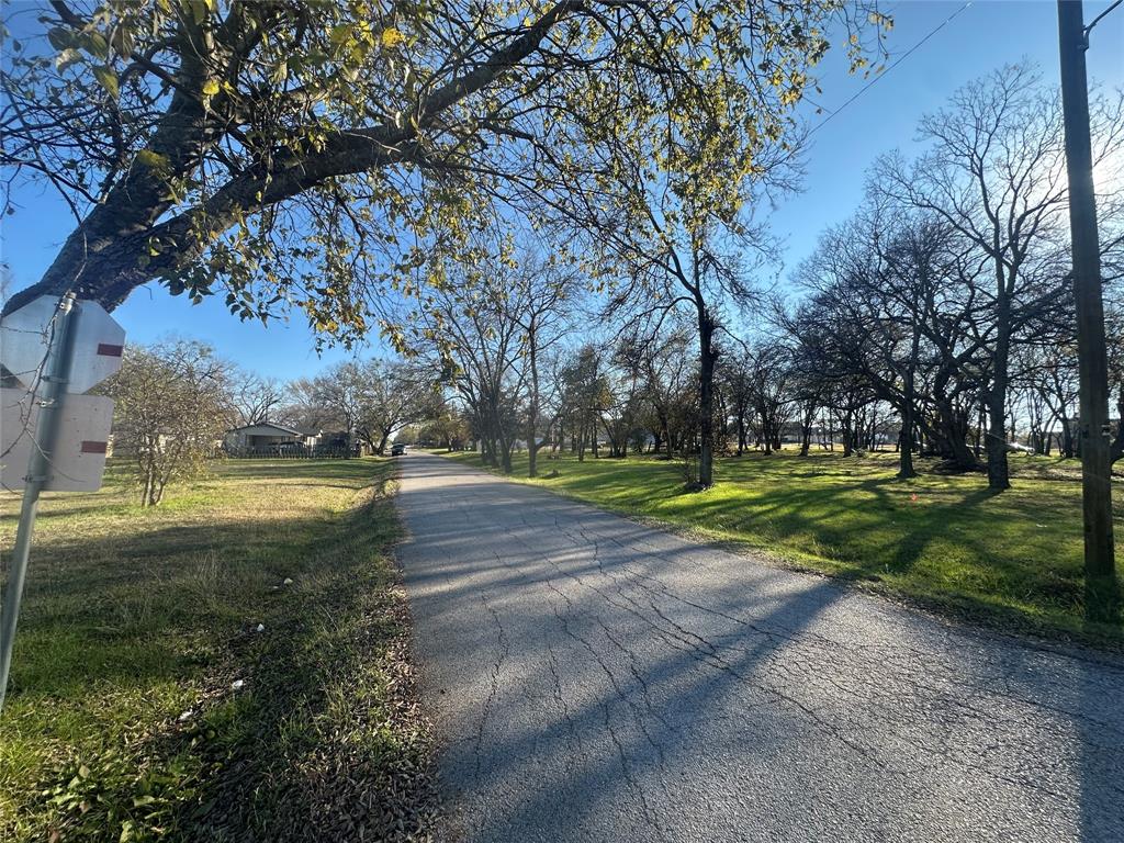 Tbd East Freeman Street Ennis, TX 75119 - Photo 5 of 11 a view of yard with swimming pool and green space
