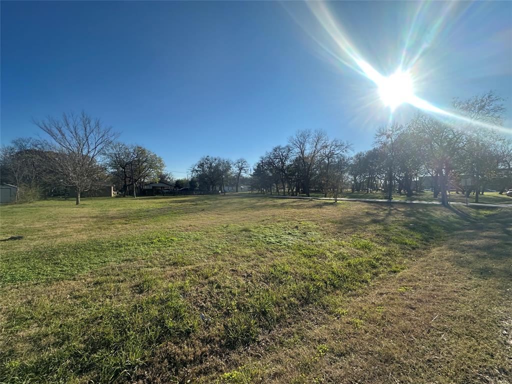 Tbd East Freeman Street Ennis, TX 75119 - Photo 8 of 11 a view of outdoor space with green field and trees all around