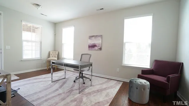 a work room with furniture and a window