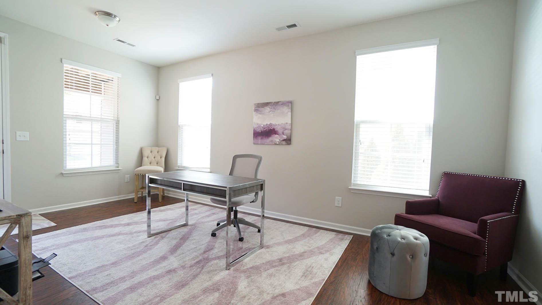 540 Metro Station Apex, NC 27502 - Photo 12 of 45 a work room with furniture and a window