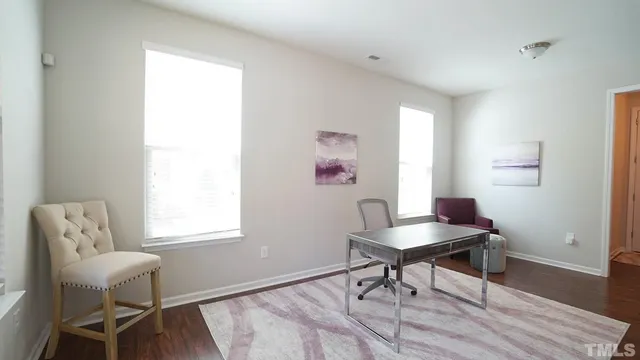 a workspace with furniture and a window