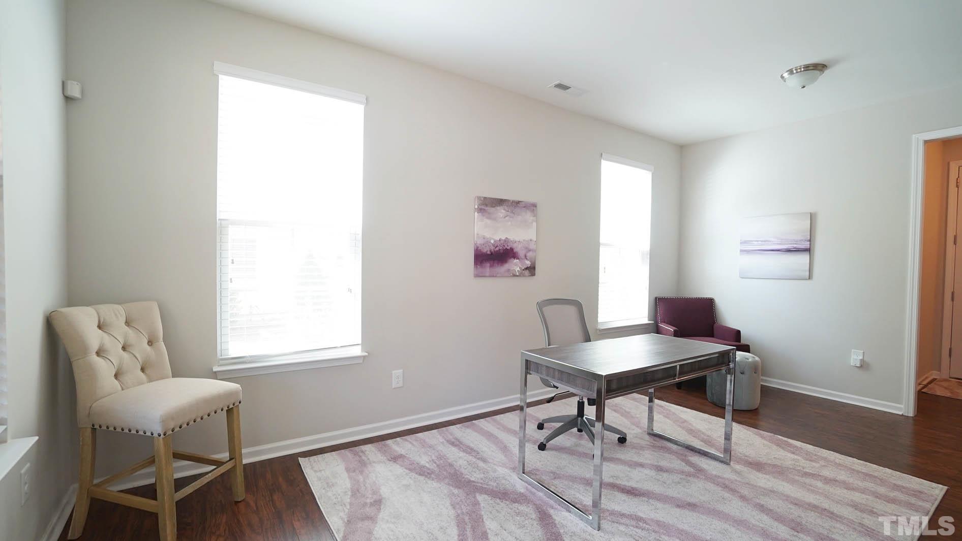 540 Metro Station Apex, NC 27502 - Photo 13 of 45 a workspace with furniture and a window
