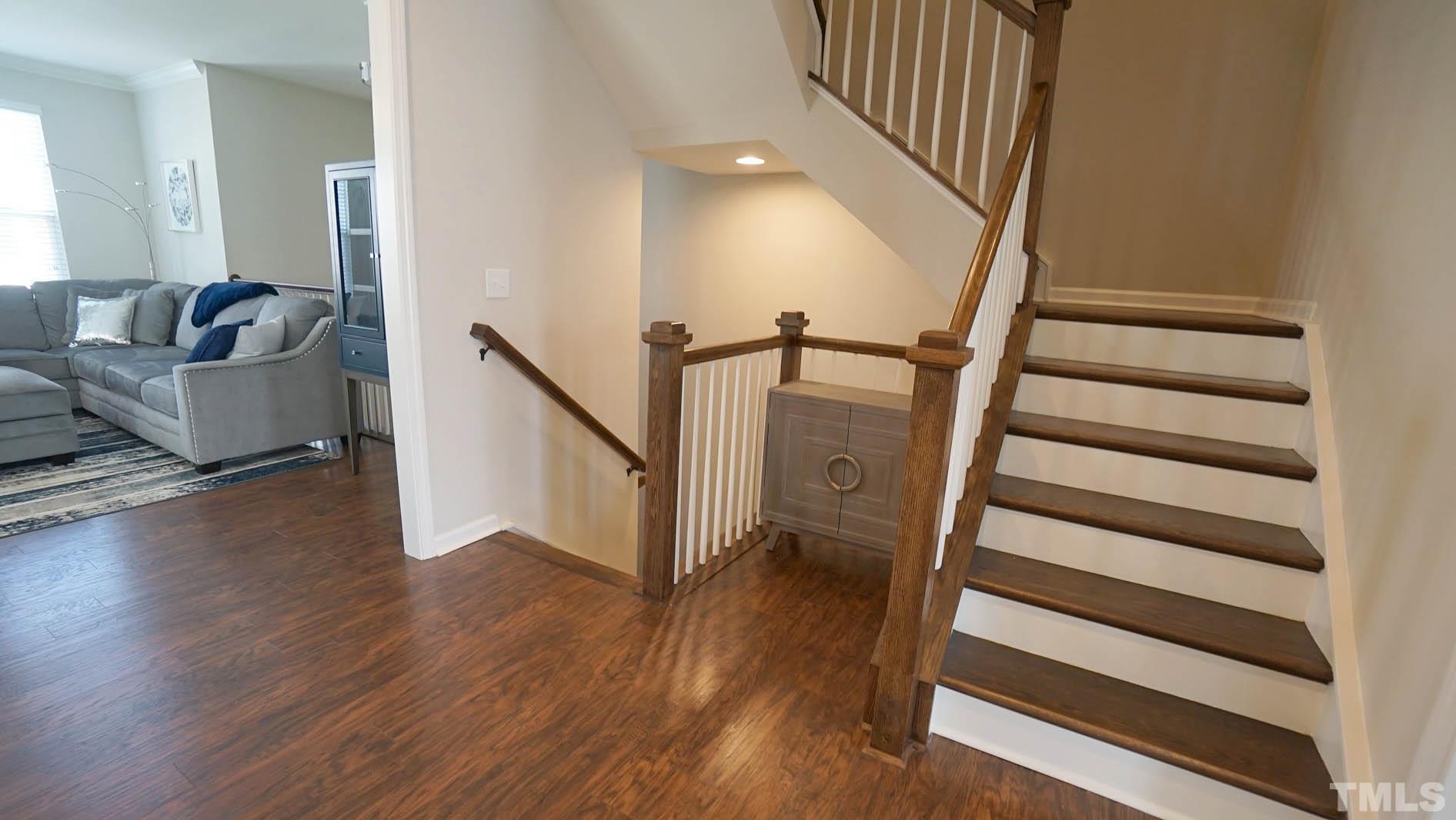 540 Metro Station Apex, NC 27502 - Photo 17 of 45 a view of entryway and hall with wooden floor