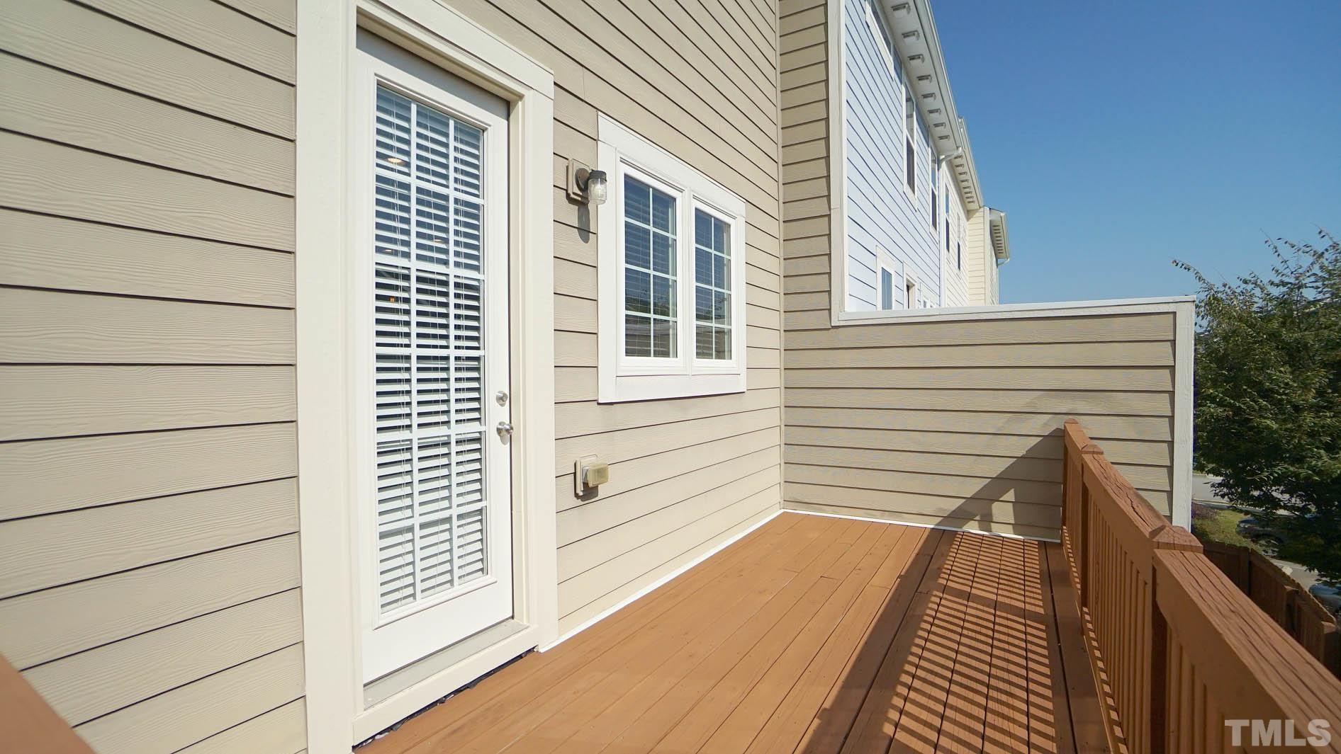 540 Metro Station Apex, NC 27502 - Photo 30 of 45 a view of a balcony with wooden floor and floor