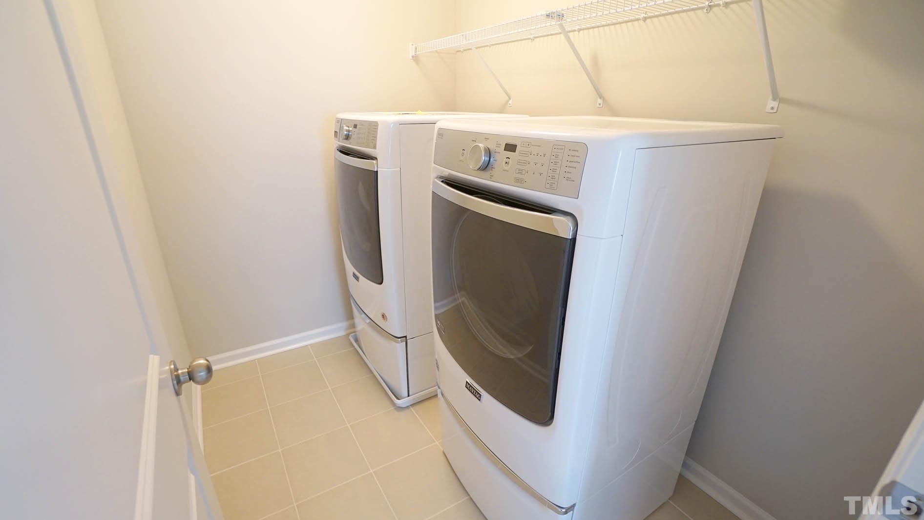 540 Metro Station Apex, NC 27502 - Photo 32 of 45 a utility room with dryer and washer