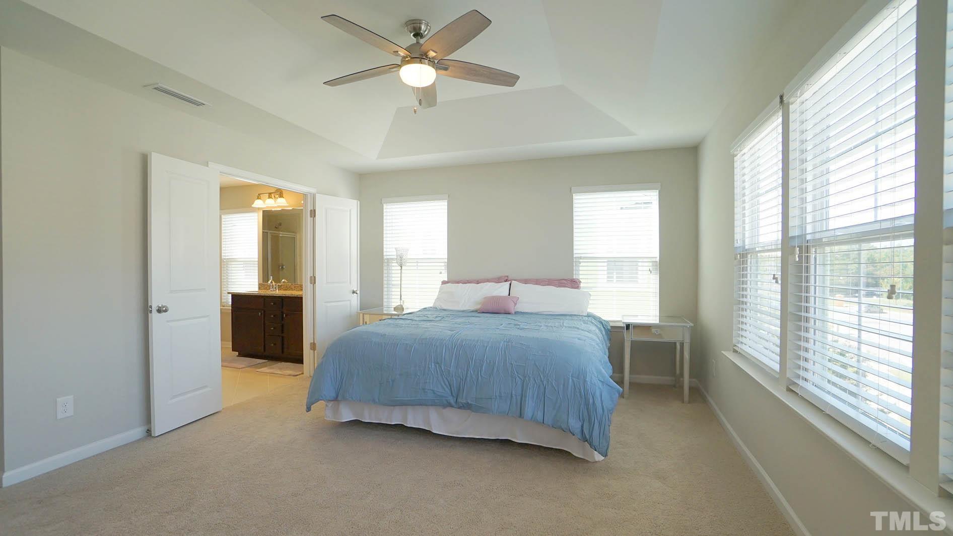 540 Metro Station Apex, NC 27502 - Photo 35 of 45 a bedroom with a bed and a large window