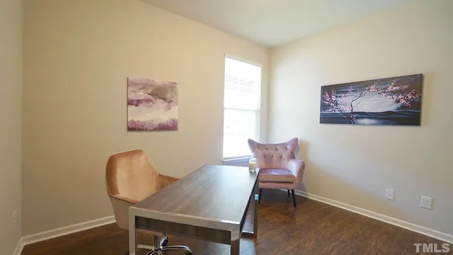 a view of a workspace with furniture and a couch