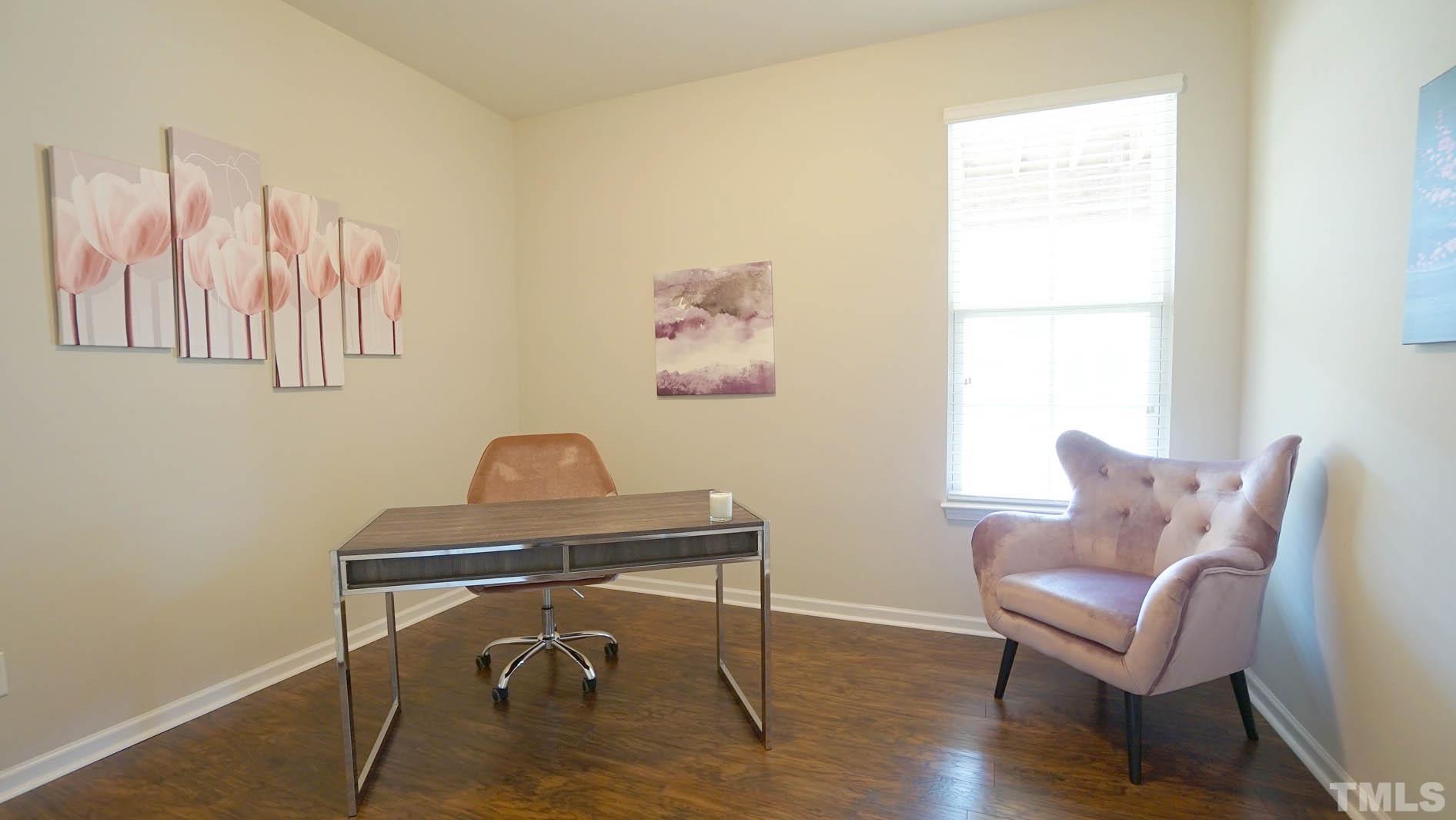 540 Metro Station Apex, NC 27502 - Photo 9 of 45 a chair and a table in a room