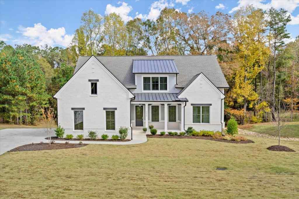 3630 Burnt Bridge Road Cumming, GA 30028 - Photo 1 of 1 a front view of a house with swimming pool