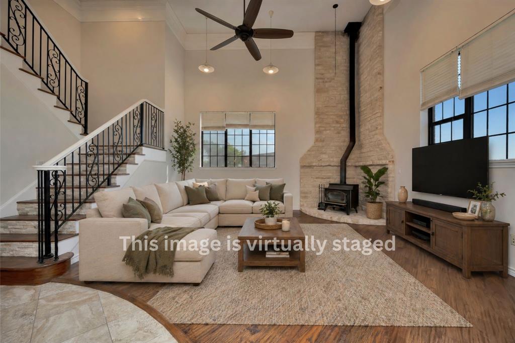 5520 White Settlement Road Weatherford, TX 76087 - Photo 15 of 39 a living room with furniture and a flat screen tv