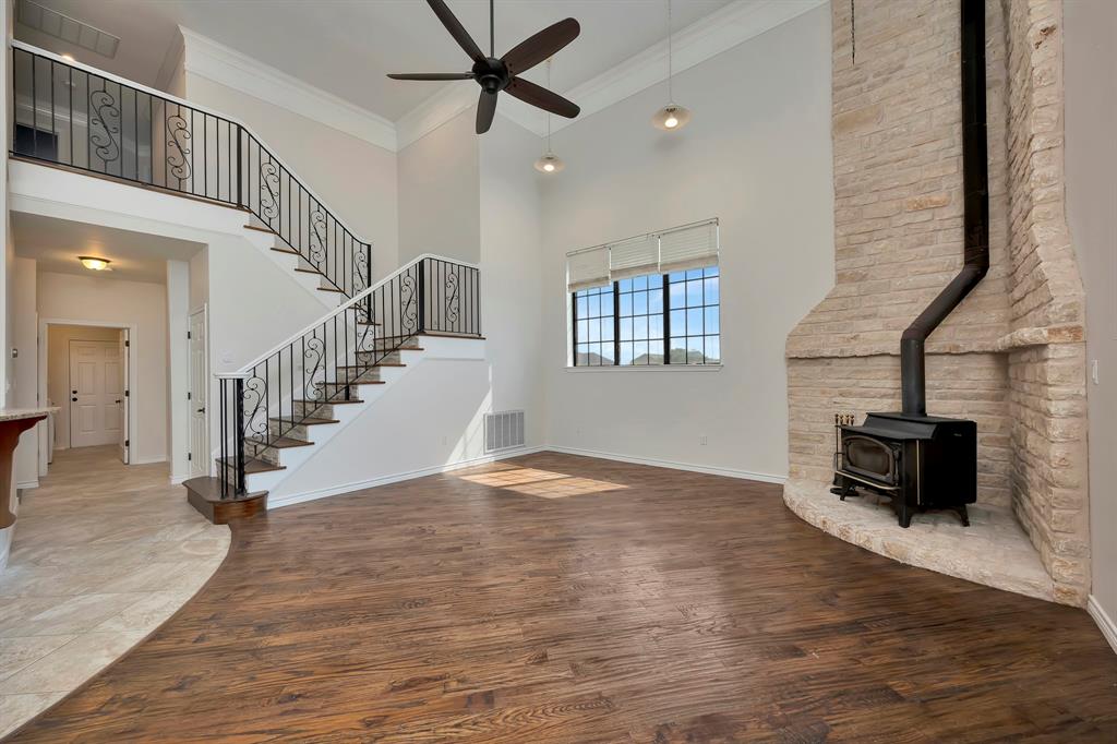 5520 White Settlement Road Weatherford, TX 76087 - Photo 17 of 39 a view of empty room with wooden floor and fan