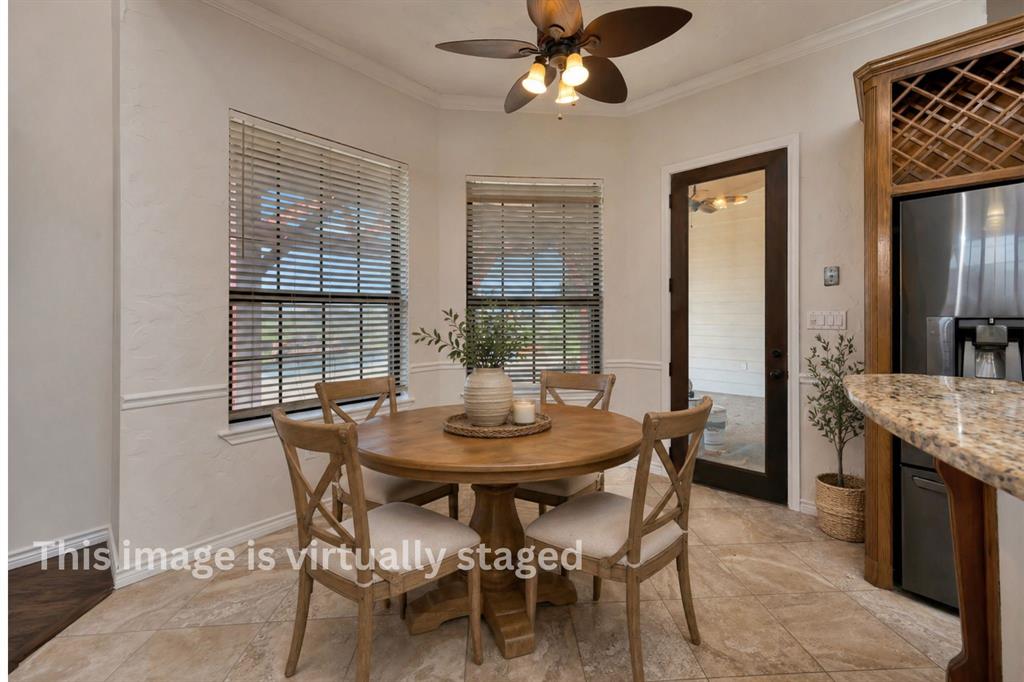 5520 White Settlement Road Weatherford, TX 76087 - Photo 20 of 39 a view of a dining room with furniture and window