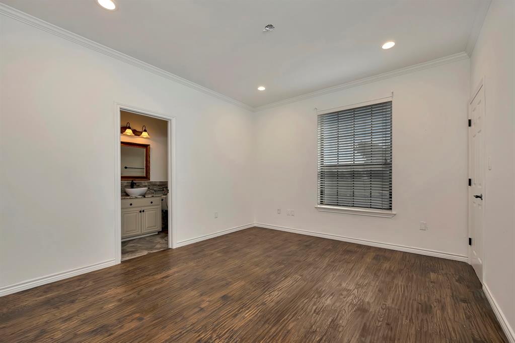 5520 White Settlement Road Weatherford, TX 76087 - Photo 25 of 39 Empty room with crown molding, dark wood-style flooring, and recessed lighting