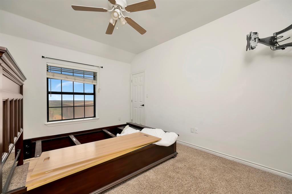 5520 White Settlement Road Weatherford, TX 76087 - Photo 35 of 39 a room with a bed and window