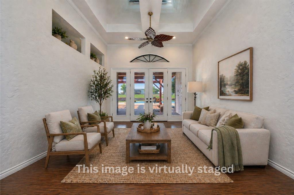 5520 White Settlement Road Weatherford, TX 76087 - Photo 5 of 39 a living room with furniture a chandelier and a rug