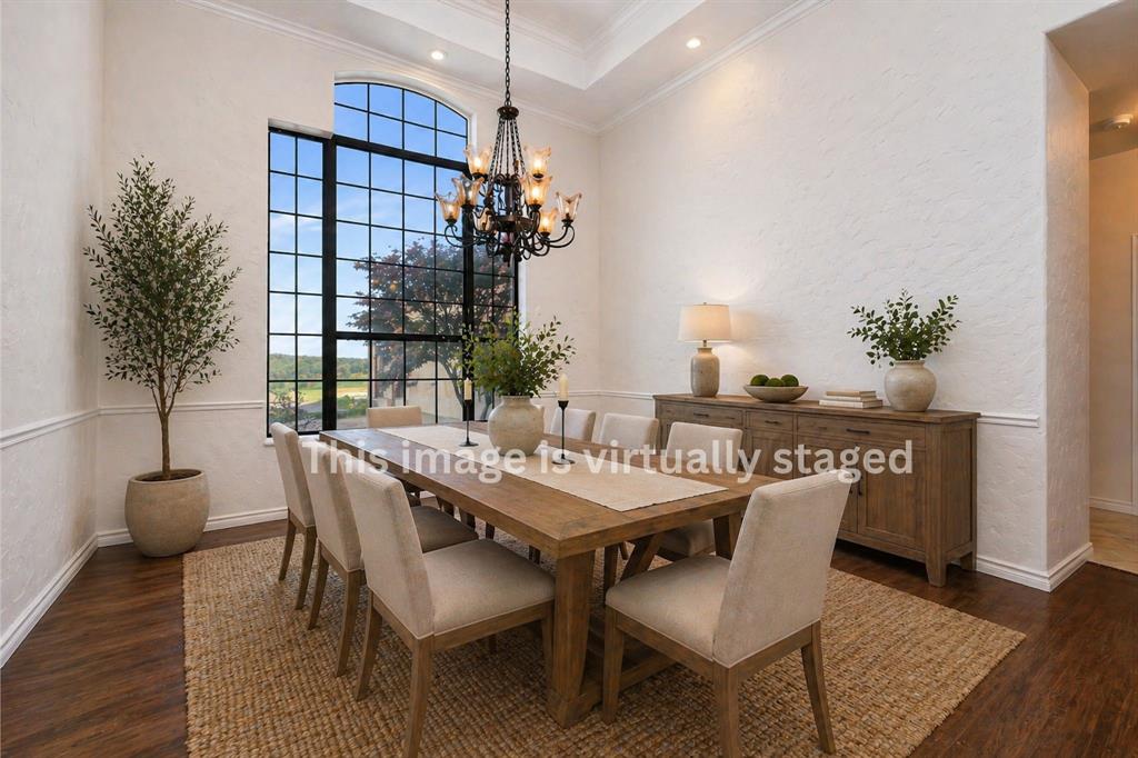 5520 White Settlement Road Weatherford, TX 76087 - Photo 10 of 39 a view of a dining room with furniture and wooden floor