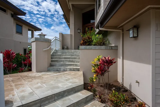 a vase of flowers sitting on a floor
