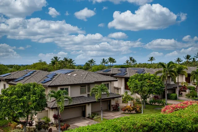an aerial view of a house with a garden