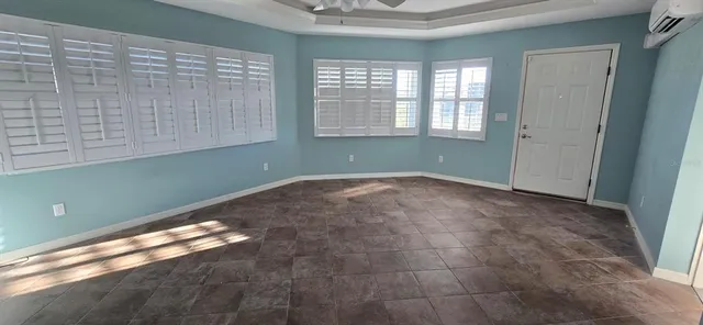 a view of an empty room with a window