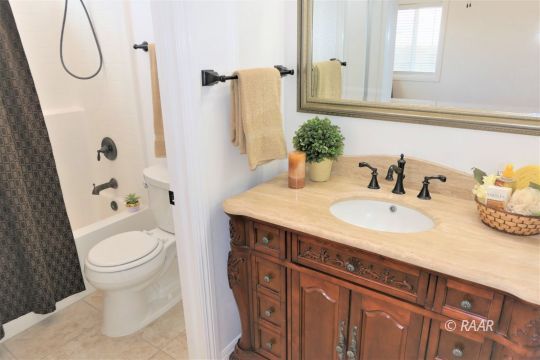 1516 Mayo Street Ridgecrest, CA 93555 - Photo 22 of 33 a bathroom with a sink toilet and shower