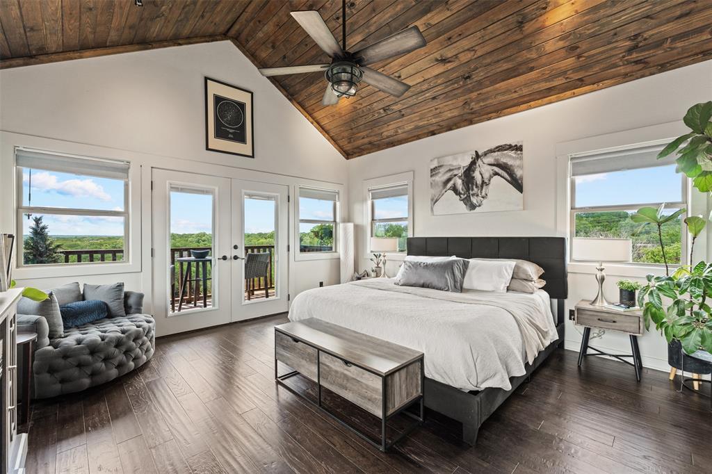 124 Bluffview Circle China Spring, TX 76633 - Photo 27 of 40 Vaulted wood-plank ceiling with a ceiling fan, dark wood-finish flooring, and white walls
