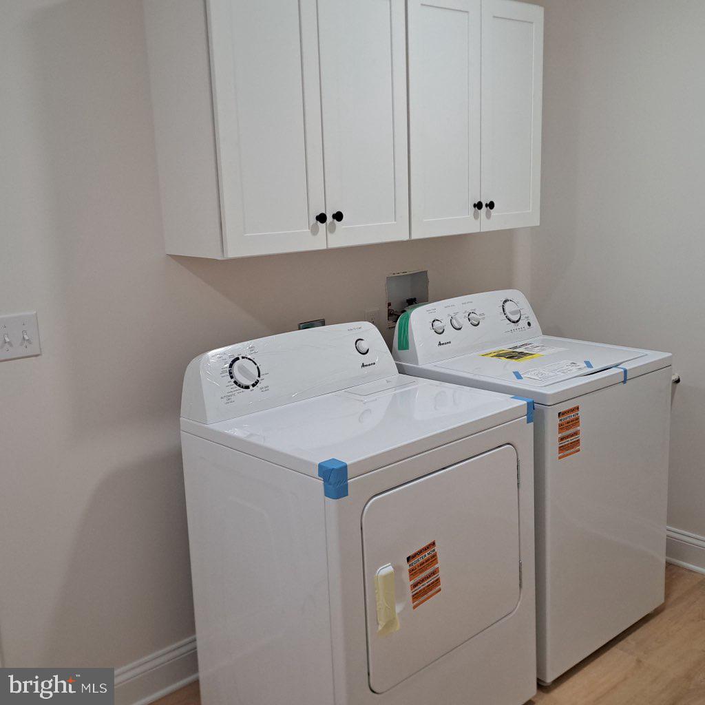 101 Thompson Street Hurlock, MD 21643 - Photo 11 of 16 a utility room with dryer and washer