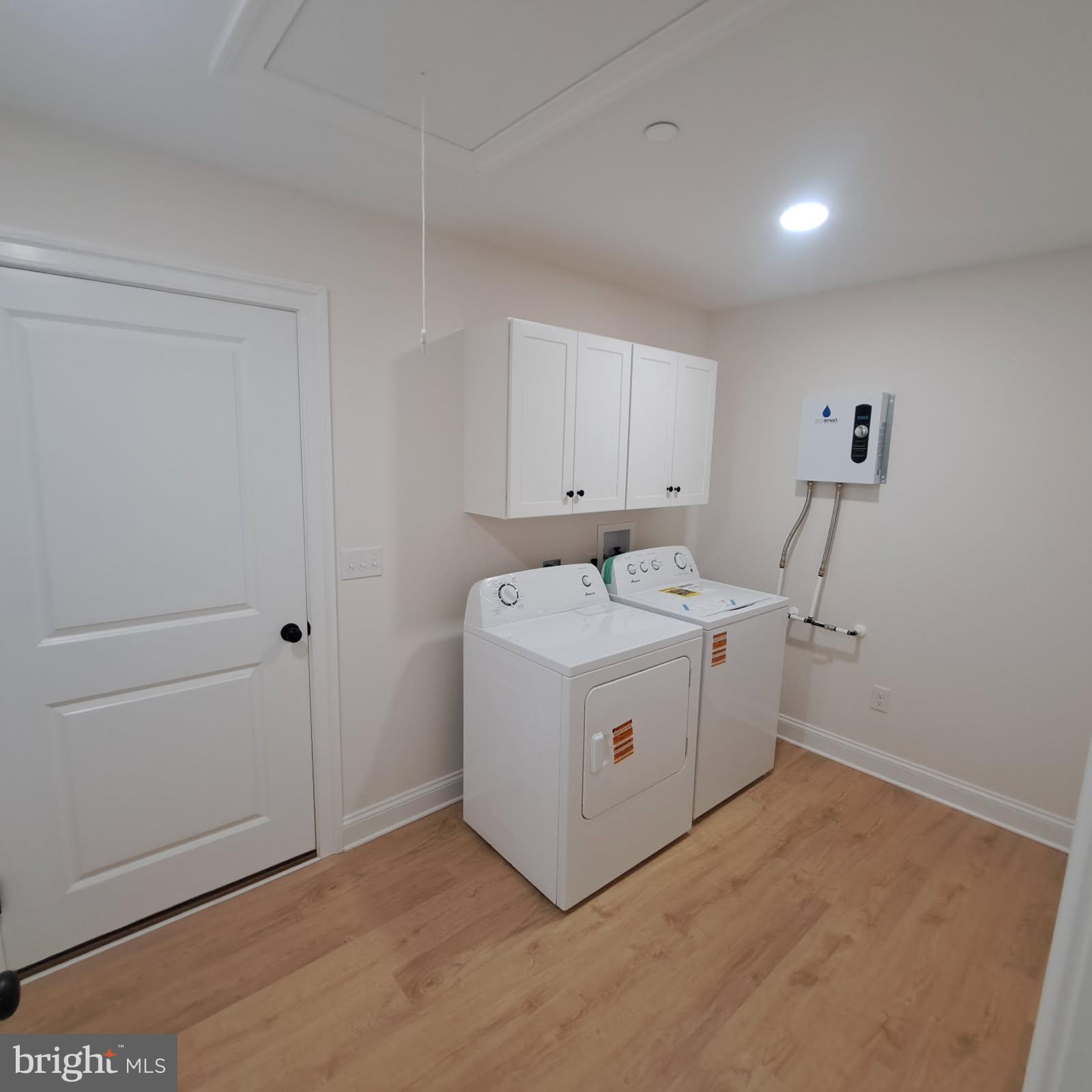 101 Thompson Street Hurlock, MD 21643 - Photo 12 of 16 a utility room with dryer and washer