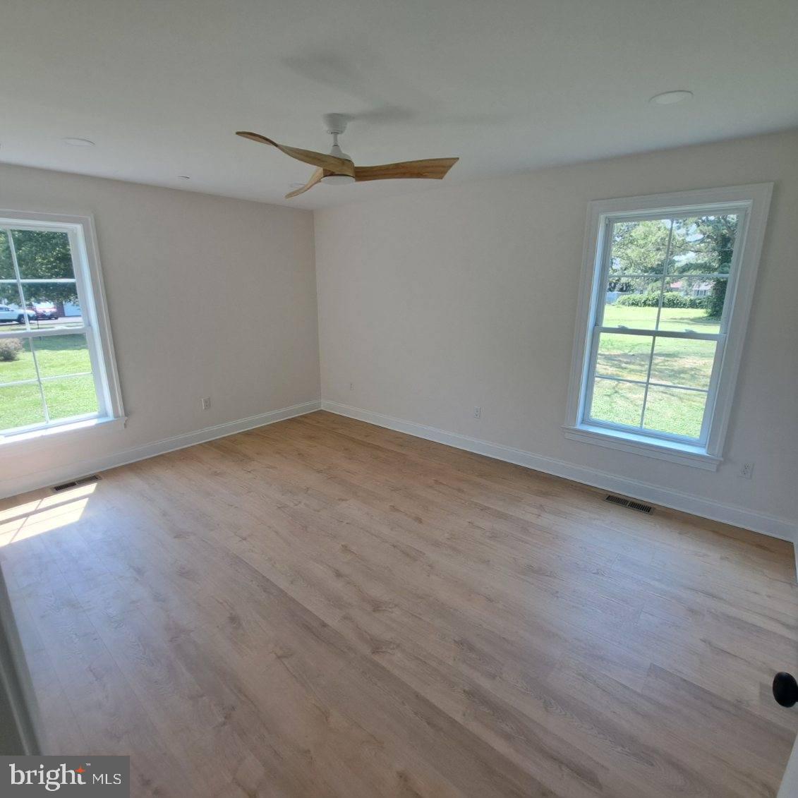 101 Thompson Street Hurlock, MD 21643 - Photo 13 of 16 an empty room with windows