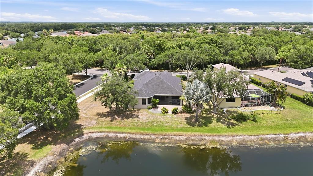 428 Snapdragon Loop Bradenton, FL 34212 - Photo 30 of 33 a view of a lake with a house