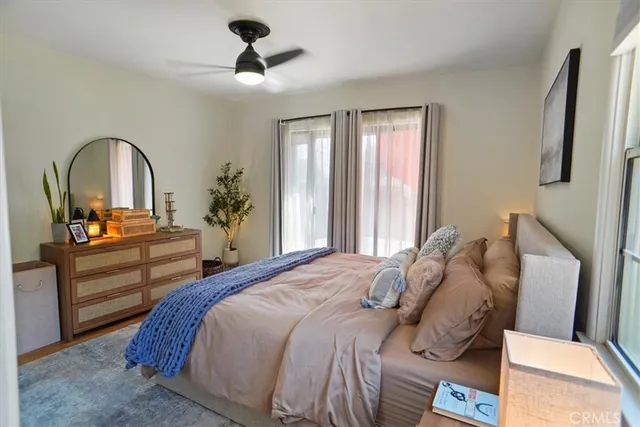 a bedroom with a bed and a dresser