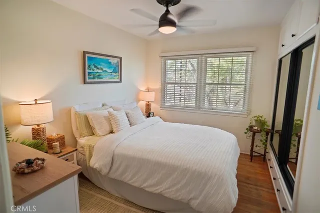 a spacious bedroom with a bed a couch and a window
