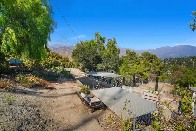 a view of a backyard with sitting area