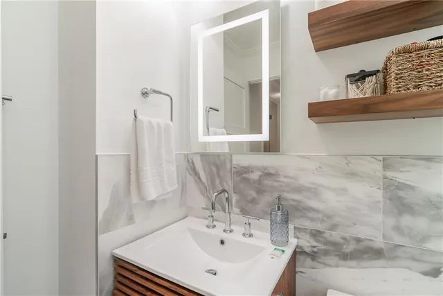 a bathroom with a sink and a mirror