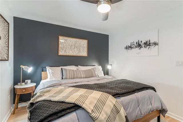 a bedroom with a bed and window