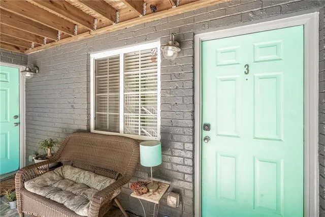 a view of a door and chair in the balcony