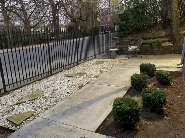 a view of a backyard with a pathway