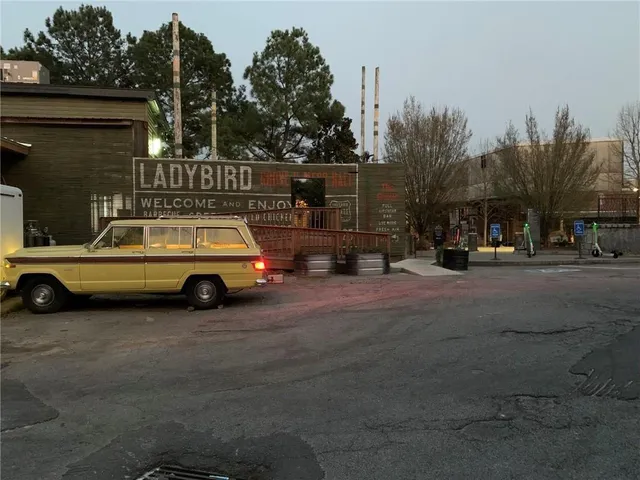 a view of a cars is parked in front of a house