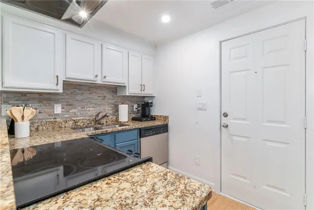 a kitchen with a sink and cabinets