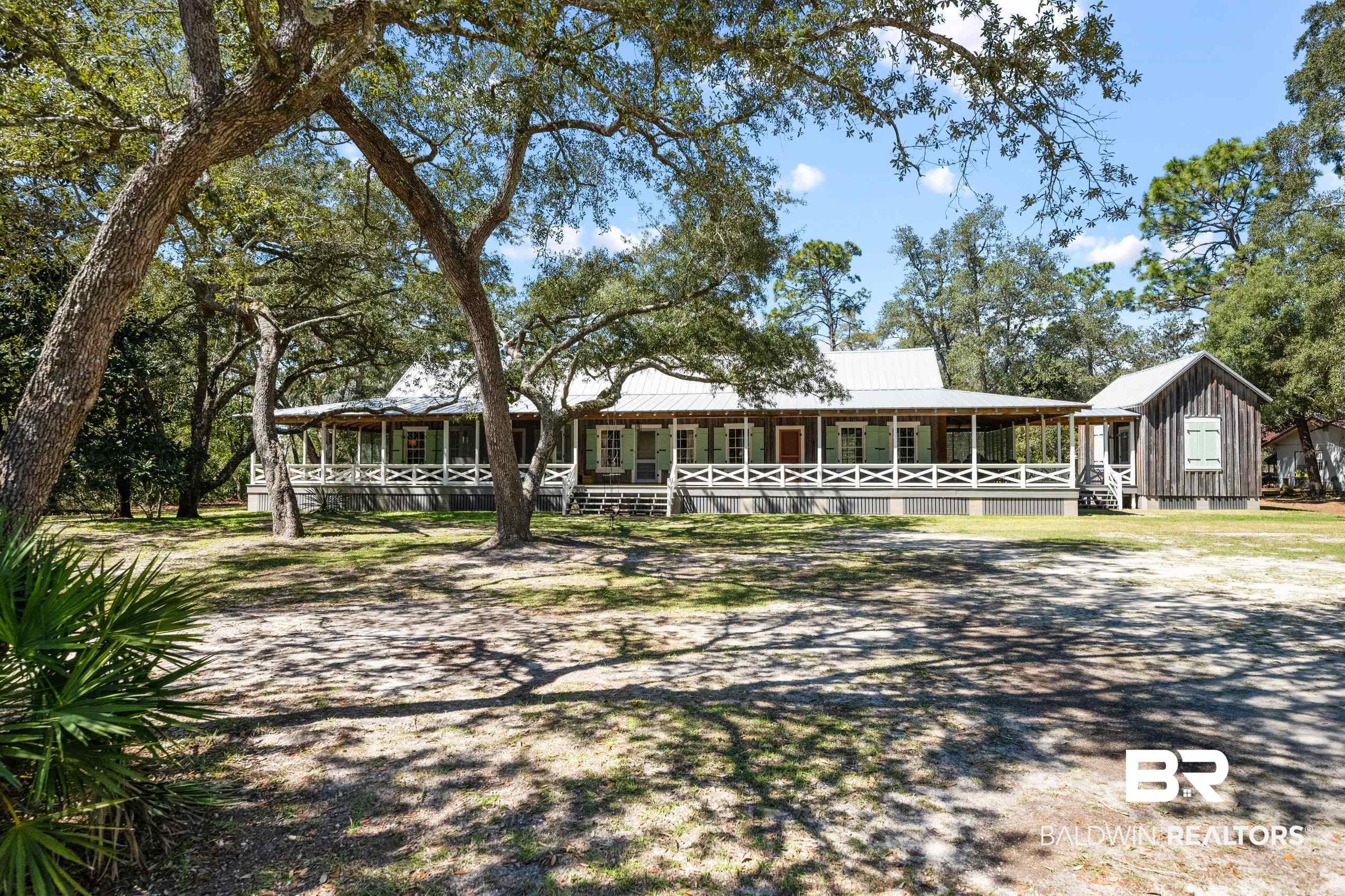 30671 Magnolia Street Elberta, AL 36530 - Photo 13 of 68 View of front of property featuring a porch and board and batten siding